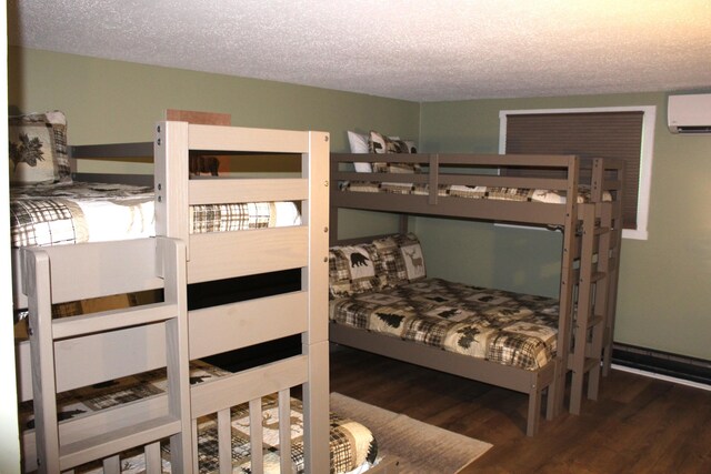 248 High Pass Way, Tannersville, PA 18372 - bedroom featuring a wall mounted AC, wood finished floors, and a textured ceiling