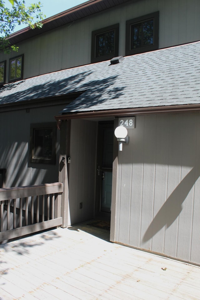 248 High Pass Way, Tannersville, PA 18372 - property entrance featuring a shingled roof and a wooden deck