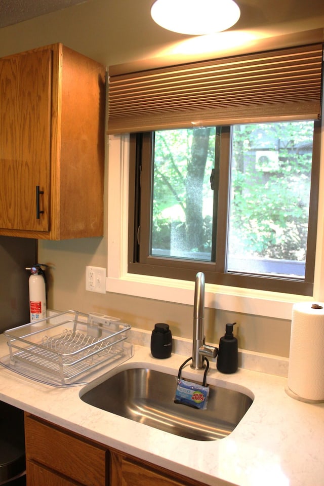 248 High Pass Way, Tannersville, PA 18372 - kitchen featuring brown cabinets and light stone countertops