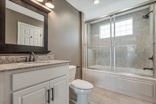 134 Laurel Hill Dr Unit 102, Greentown, PA 18426 - bathroom with tile patterned floors, bath / shower combo with glass door, vanity, and toilet
