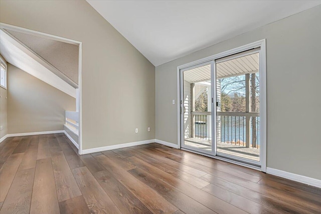 134 Laurel Hill Dr Unit 102, Greentown, PA 18426 - unfurnished room with baseboards, dark wood-style floors, and lofted ceiling