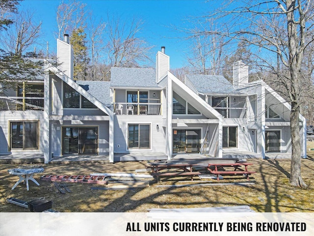 134 Laurel Hill Dr Unit 102, Greentown, PA 18426 - back of house featuring a patio area, a balcony, and a chimney