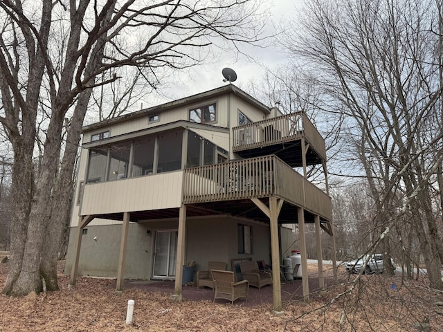248 Penn Forest Trl, Albrightsville, PA 18210 - back of property with a deck and a sunroom