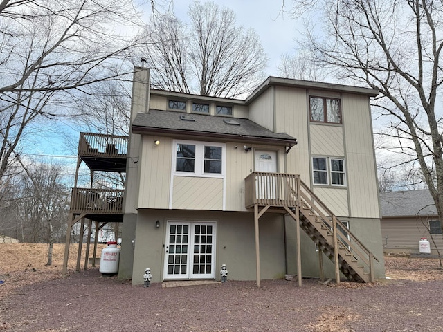 248 Penn Forest Trl, Albrightsville, PA 18210 - back of property featuring stairs, roof with shingles, and a chimney