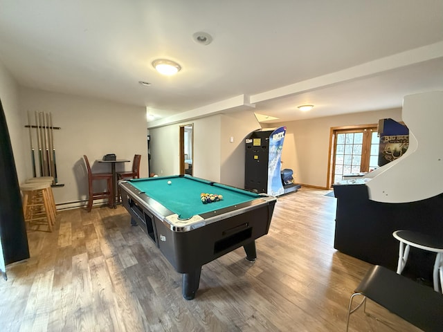 playroom with billiards, a baseboard radiator, wood finished floors, and baseboards