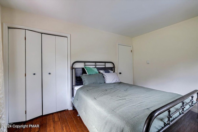 bedroom featuring a closet and wood finished floors