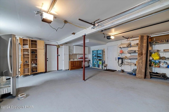 garage with refrigerator and a garage door opener