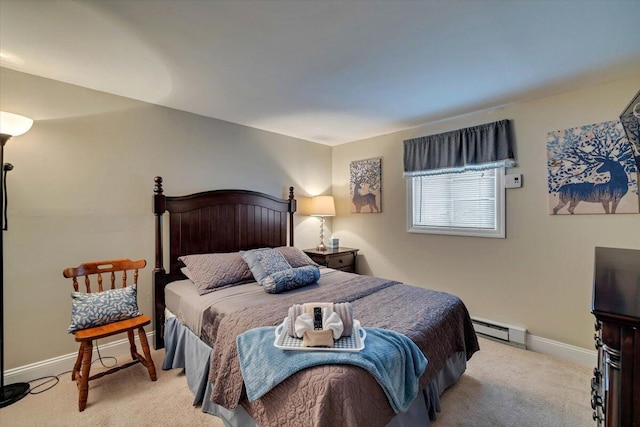 bedroom with a baseboard heating unit, light carpet, and baseboards