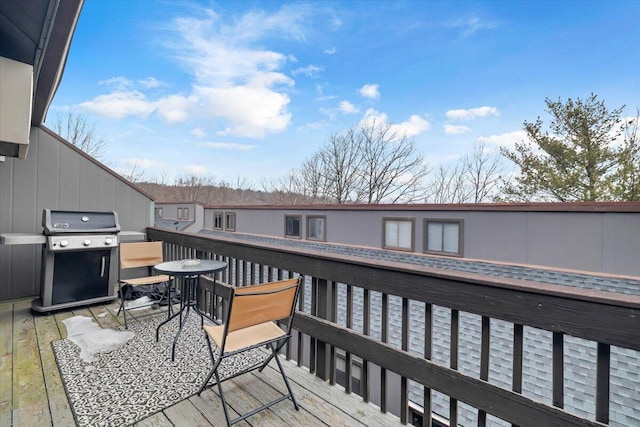 wooden terrace featuring grilling area