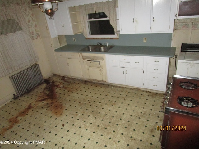 146 Buttonwood St, Jessup, PA 18434 - kitchen featuring white cabinetry, radiator, light floors, and a sink