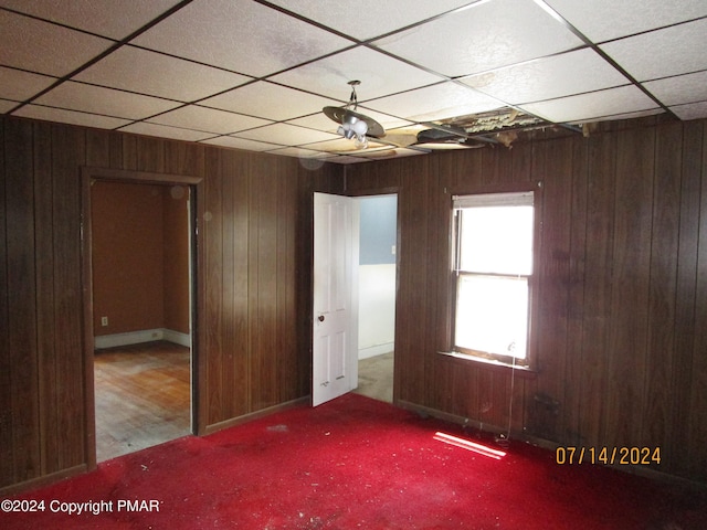146 Buttonwood St, Jessup, PA 18434 - unfurnished bedroom featuring wood walls and a paneled ceiling