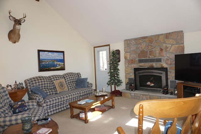 carpeted living area featuring visible vents, a stone fireplace, and vaulted ceiling