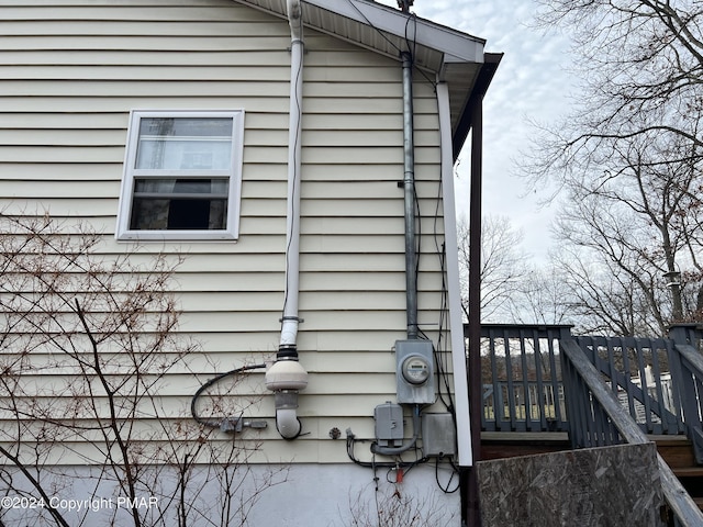 view of side of property with a wooden deck