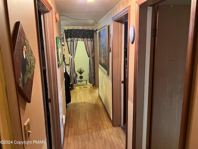 hall featuring wood finished floors