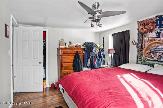 bedroom featuring ceiling fan and wood finished floors