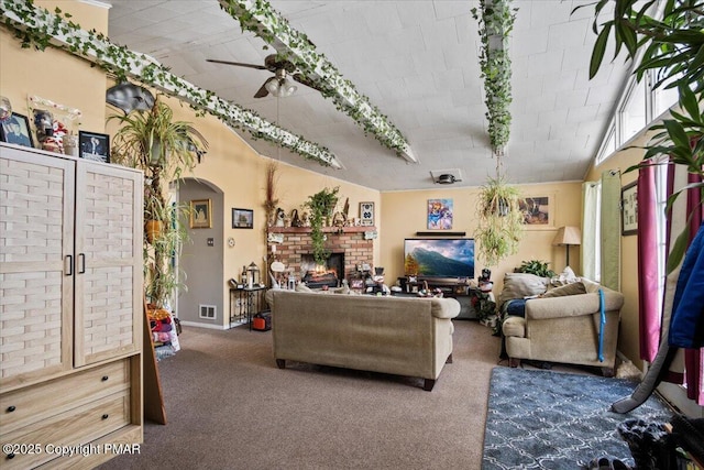 carpeted living room with arched walkways, ceiling fan, a fireplace, and visible vents