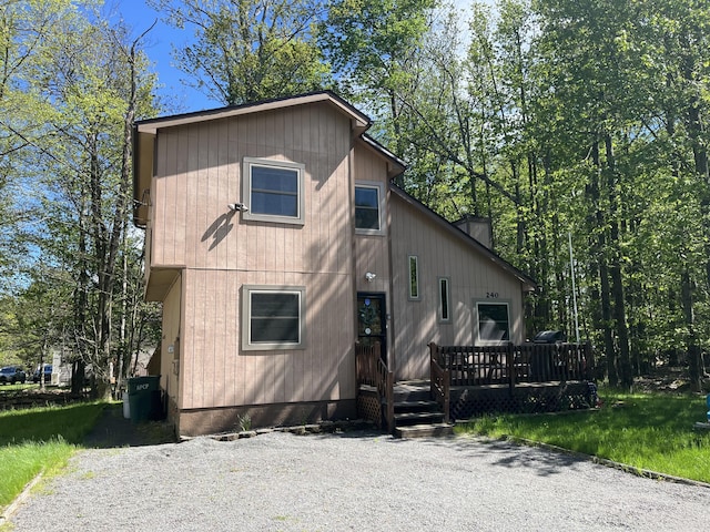 1076 Knollwood Dr, Tobyhanna, PA 18466 - view of front of home featuring a deck and a chimney