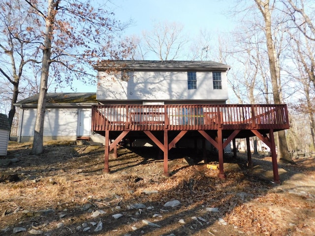 rear view of property featuring a deck