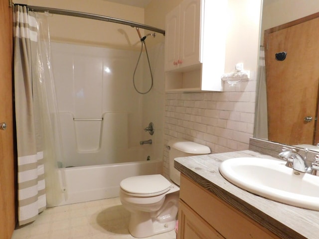 full bathroom with tile patterned floors, toilet, shower / bath combo, tile walls, and vanity