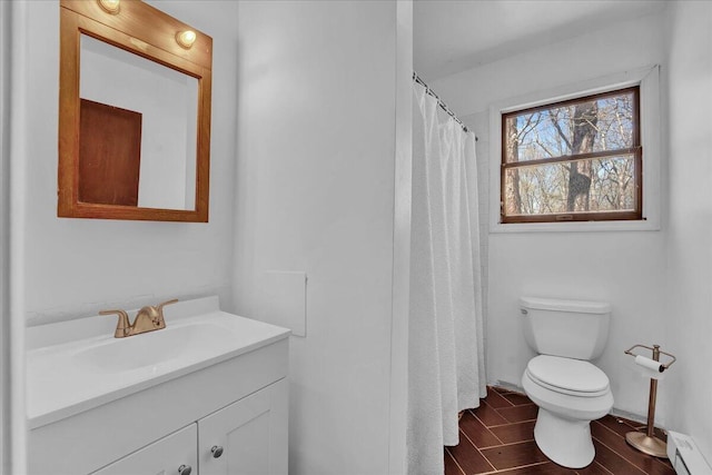 41 Pinoak Dr, Jim Thorpe, PA 18229 - full bathroom with baseboard heating, vanity, wood finished floors, and a shower with shower curtain
