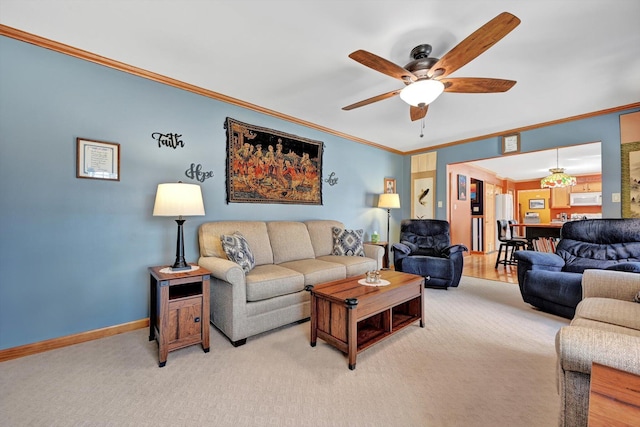 living room with baseboards, light carpet, ceiling fan, and crown molding