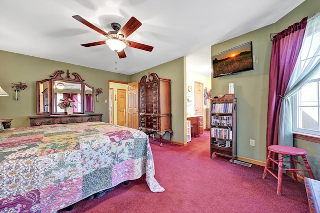 carpeted bedroom with multiple windows, baseboards, and ceiling fan