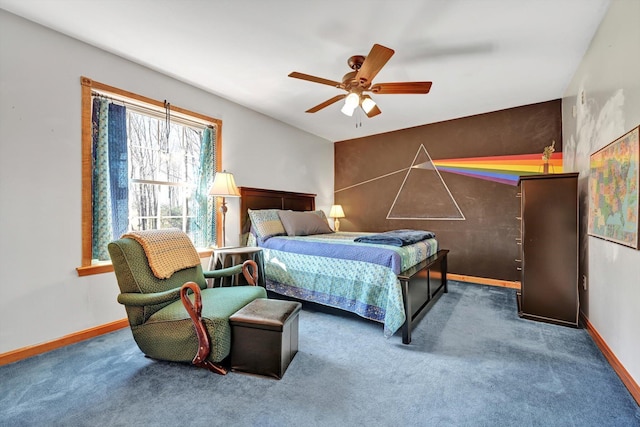 carpeted bedroom featuring baseboards and ceiling fan