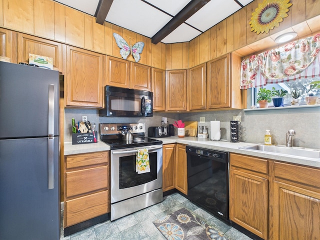 203 Old Rte 940, Pocono Pines, PA 18350 - kitchen featuring black appliances, light countertops, backsplash, and brown cabinetry