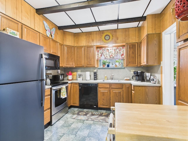 203 Old Rte 940, Pocono Pines, PA 18350 - kitchen featuring black appliances, light countertops, brown cabinets, and decorative backsplash