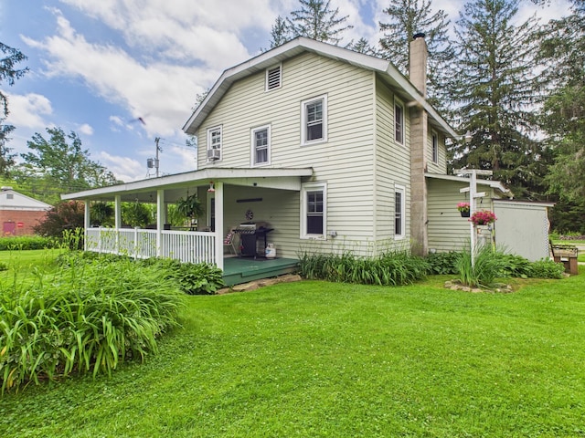 203 Old Rte 940, Pocono Pines, PA 18350 - rear view of property with a lawn, a chimney, and covered porch