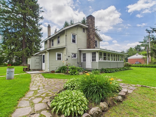203 Old Rte 940, Pocono Pines, PA 18350 - back of property featuring a chimney, a yard, and a sunroom