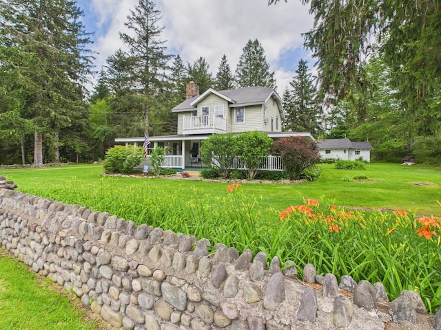 203 Old Rte 940, Pocono Pines, PA 18350 - farmhouse-style home featuring a chimney, a balcony, and a front lawn