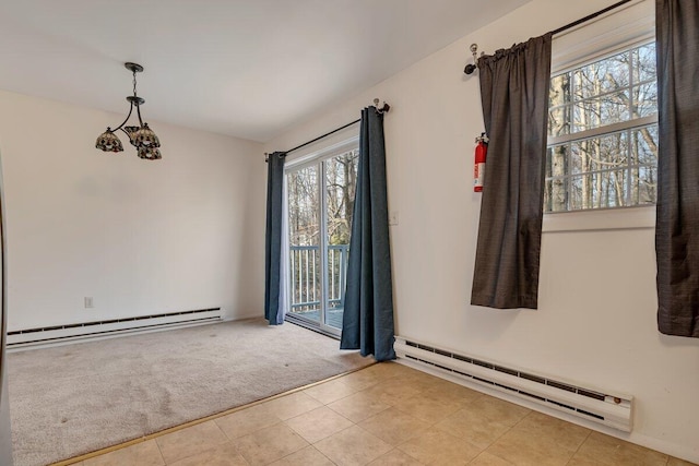 carpeted spare room with an inviting chandelier and a baseboard radiator