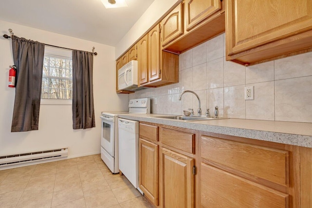 kitchen with backsplash, light countertops, baseboard heating, white appliances, and a sink