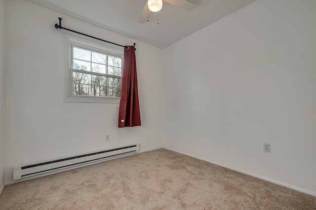 carpeted empty room with a ceiling fan, baseboards, and a baseboard radiator