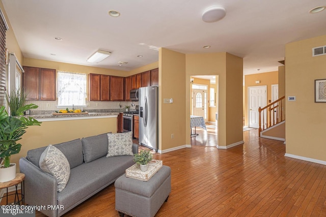 living room with light hardwood / wood-style flooring