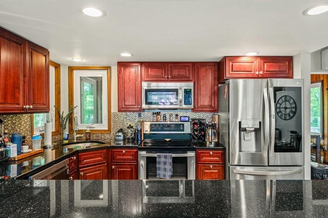 108 Bayberry Ct, Stroudsburg, PA 18360 - living area featuring vaulted ceiling, wood finished floors, healthy amount of natural light, and a textured ceiling