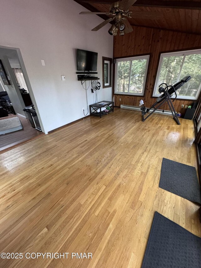108 Bayberry Ct, Stroudsburg, PA 18360 - exercise area with lofted ceiling, healthy amount of natural light, wood walls, wood finished floors, and ceiling fan