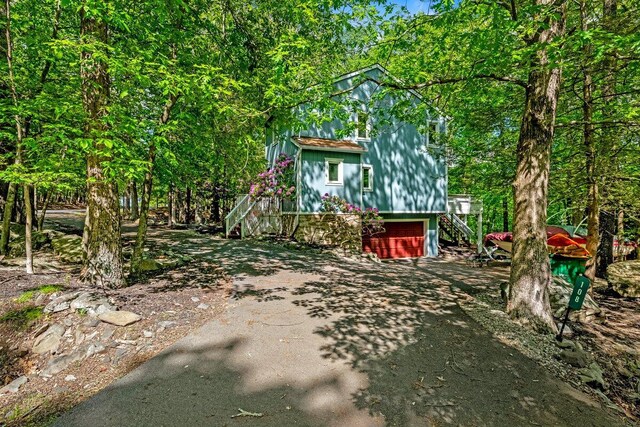 108 Bayberry Ct, Stroudsburg, PA 18360 - view of yard with stairs, asphalt driveway, and a garage