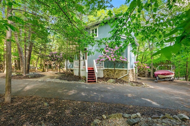 108 Bayberry Ct, Stroudsburg, PA 18360 - view of home's exterior featuring stairs, a deck, and asphalt driveway