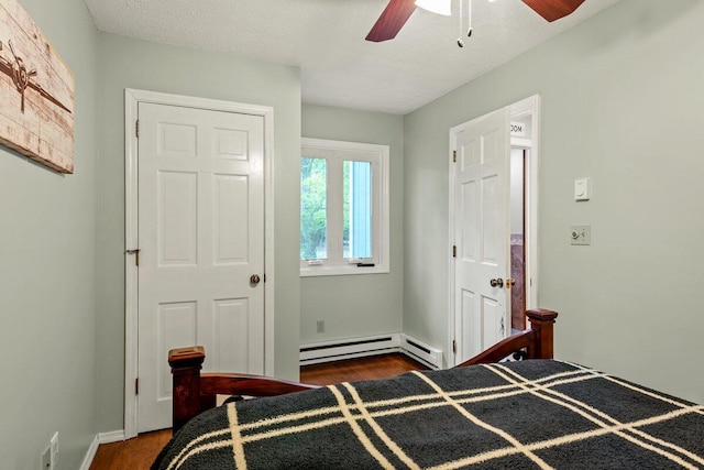 108 Bayberry Ct, Stroudsburg, PA 18360 - bedroom featuring a baseboard radiator, wood finished floors, and a ceiling fan