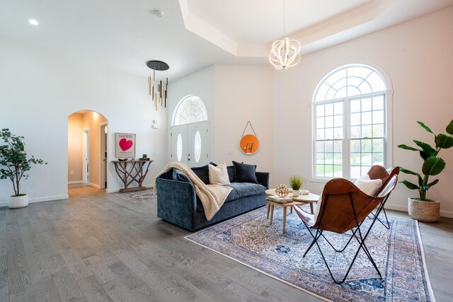 901 Meyer Rd, Nazareth, PA 18064 - living room featuring an inviting chandelier, a wealth of natural light, and arched walkways