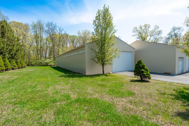 901 Meyer Rd, Nazareth, PA 18064 - view of home's exterior featuring a detached garage, an outbuilding, and a lawn