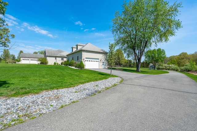 901 Meyer Rd, Nazareth, PA 18064 - view of front facade featuring a garage, a front lawn, stone siding, and driveway