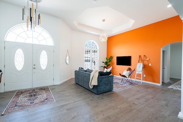 901 Meyer Rd, Nazareth, PA 18064 - entryway with wood finished floors, a high ceiling, a tray ceiling, baseboards, and arched walkways
