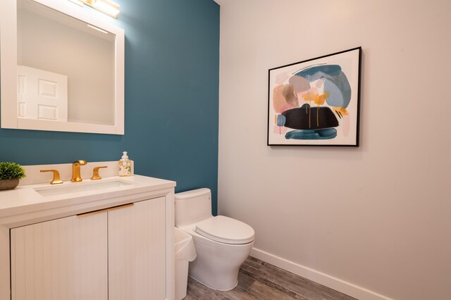 901 Meyer Rd, Nazareth, PA 18064 - bathroom with toilet, baseboards, vanity, and wood finished floors