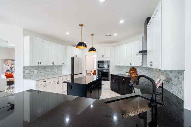 901 Meyer Rd, Nazareth, PA 18064 - kitchen with a sink, freestanding refrigerator, stainless steel double oven, visible vents, and backsplash