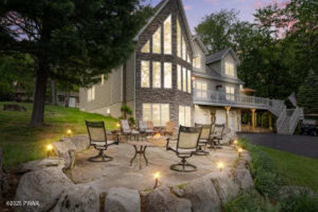 7 Shore Line Dr, Lakeville, PA 18438 - rear view of house with a patio and stairway