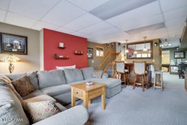 7 Shore Line Dr, Lakeville, PA 18438 - carpeted living room with a drop ceiling and plenty of natural light
