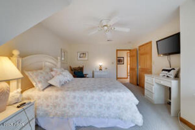 7 Shore Line Dr, Lakeville, PA 18438 - bedroom with light colored carpet, baseboards, and a ceiling fan